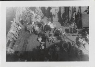 [Crew members on deck of ship.]