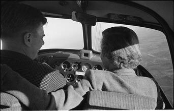 Arthur Godfrey [Godfrey flying an airplane.]