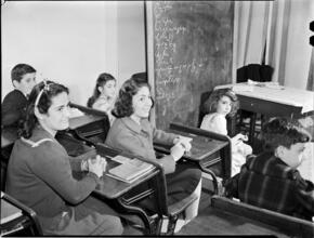 [Students in a classroom.]