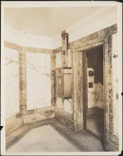 [Interior, elevator lobby.]