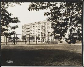 [Grounds of apartment building.]