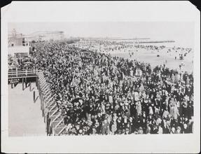 [Crowded Coney Island Boardwalk on a cold day.]