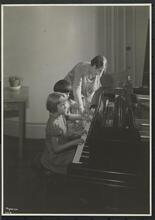 New York Association for the Blind, Interior, Group of three, Mrs. Immeln Instructing Two Small Girls at Piano.
