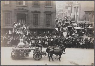 [A. Horse-drawn fire equipment in a parade ; B. Horse-drawn fire equipment in a parade.]