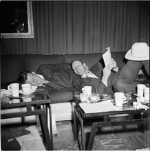 Arthur Godfrey [Godfrey and another man laying on a couch.]