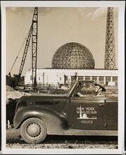 [New York World's Fair. Motor police officer in front of New York City Building. Construction view. (With the Trylon and Perisphere in the background.),]