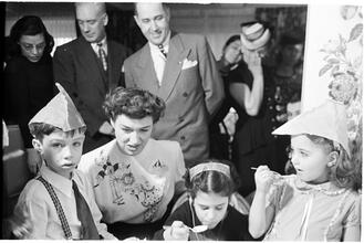 Deaf Children [Eating cake at a party.]