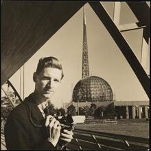 [New York World's Fair. Richard Wurts with steel frame of Perisphere and Trylon in background.]