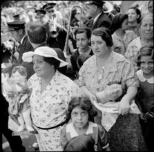 [Spectators at a religious procession.]
