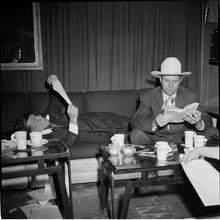 Arthur Godfrey [Godfrey and another man reading on a couch.]