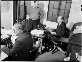 [Men at typewriters.]