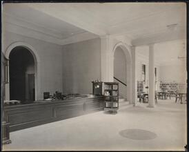 [Library. Interior at desk.]