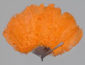 Folding feather fan of orange ostrich