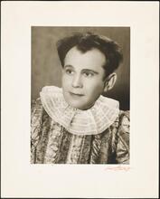 [Joshua Zeldis in costume with a lace collar.]