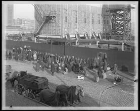 East 110th Street at the Harlem River. Distributing coke [coal] to the poor people.