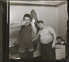 Rocky Graziano, He's a Good Boy Now [Rocky Graziano taping his hands before a fight.]