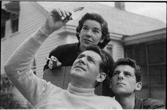 Leonard Bernstein [Leonard Bernstein and two other people looking at a negative.]