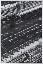 [Removal of catwalk and trucking away salvaged lumber.]