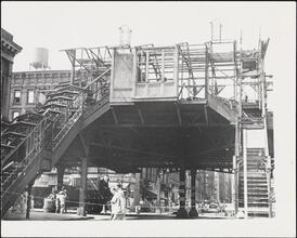 [Demolition of a Third Avenue El Station looking west towards 3rd Avenue on East 84th Street and the demolition of the E. 84th Street uptown train station.]
