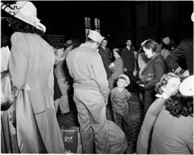 Penn Station [Soldier reuniting with his family.]