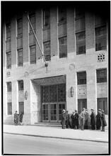 Brooklyn Law School. Entrance detail vertical with figures.