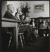 Columbia University [Professor with students in an office.]