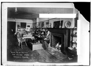 Alice Palmer sitting by the fire in the Village Store