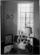 H.C. Woodall [residence]. Down shot on table and window view.