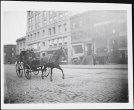 [Firemen in carriage.]