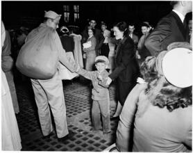 Penn Station [Soldier reuniting with his family.]