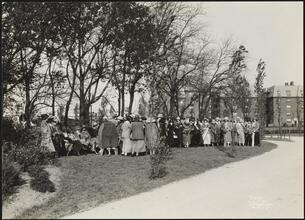 [Large group of women outdoors in Jackson Heights.]
