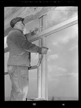 750 3rd Avenue Between 46th and 47th Street. [Construction view], Measuring and Lining Up Frames Before Tightening Bolts