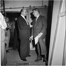 Arthur Godfrey [Godfrey talking to a man.]