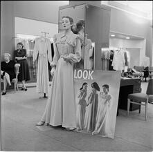 Lord & Taylor Display [A mannequin dressed in a housecoat in front of a LOOK magazine poster.]