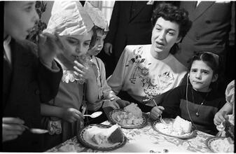Deaf Children [Eating cake at a party.]