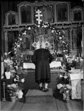 [Man at an altar.]