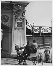 [Cart passing near arch at the opening of Grant's Tomb]