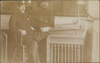 [Fireman at desk]
