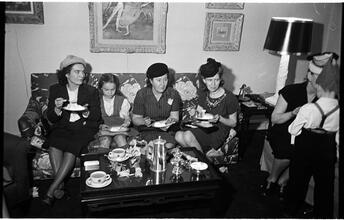 Deaf Children [Teachers eating cake at a party.]