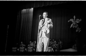 Vaughn Monroe [Man performing on stage.]