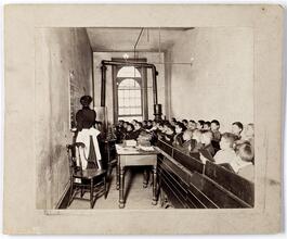 East Side Public Schools 1. A class in the condemned Essex Market School, Gas burning by day.