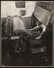 Unz & Co., Printers and Stationers, Fourth Floor, Pressman Working on Miehle Press.