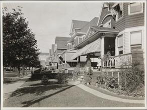 [Houses with awnings near Kingsbridge Armory.]
