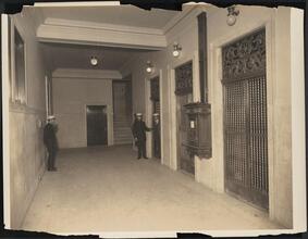 [Interior, elevator lobby.]