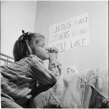 Orphanage [Girl praying before bed.]