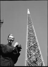 [Richard Wurts next to the frame of the Trylon during construction of the New York World's Fair site.]