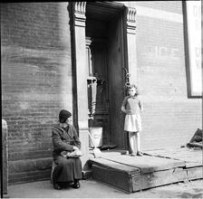 Girl and Man on Doorstep