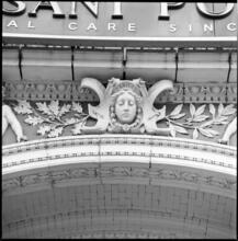 [Ornamentation above the entrance to the Stuyvesant Polyclinic, 137 Second Avenue.]