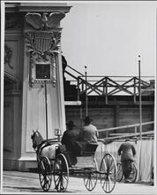 [Cart passing near arch at opening of Grant's Tomb]