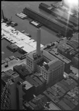 [Elevated view of industrial waterfront.]